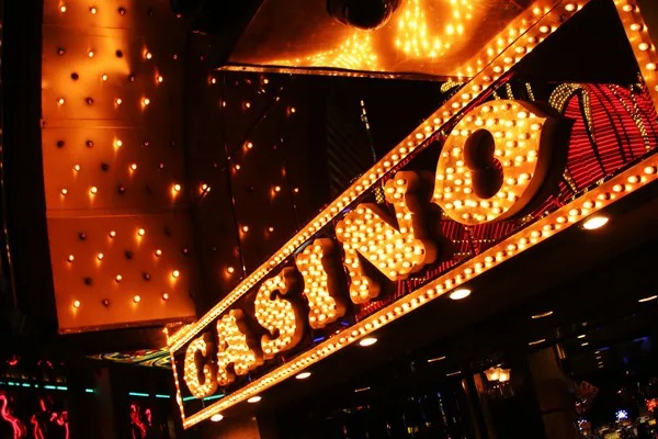 link qrisbos mobile app interface showing slot tournaments and live dealer tables